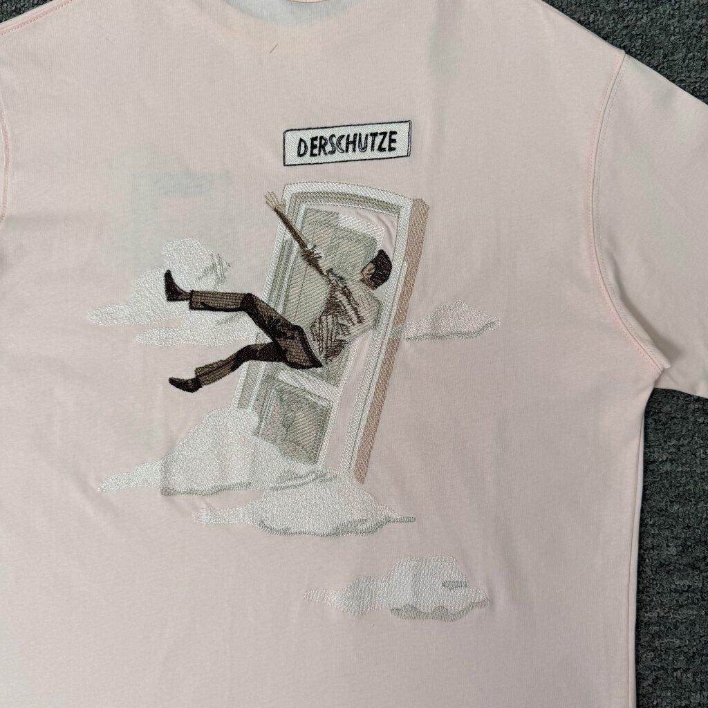 Derschutze Light Pink Surreal Sky‑Door Figure Back‑Print Graphic Tee