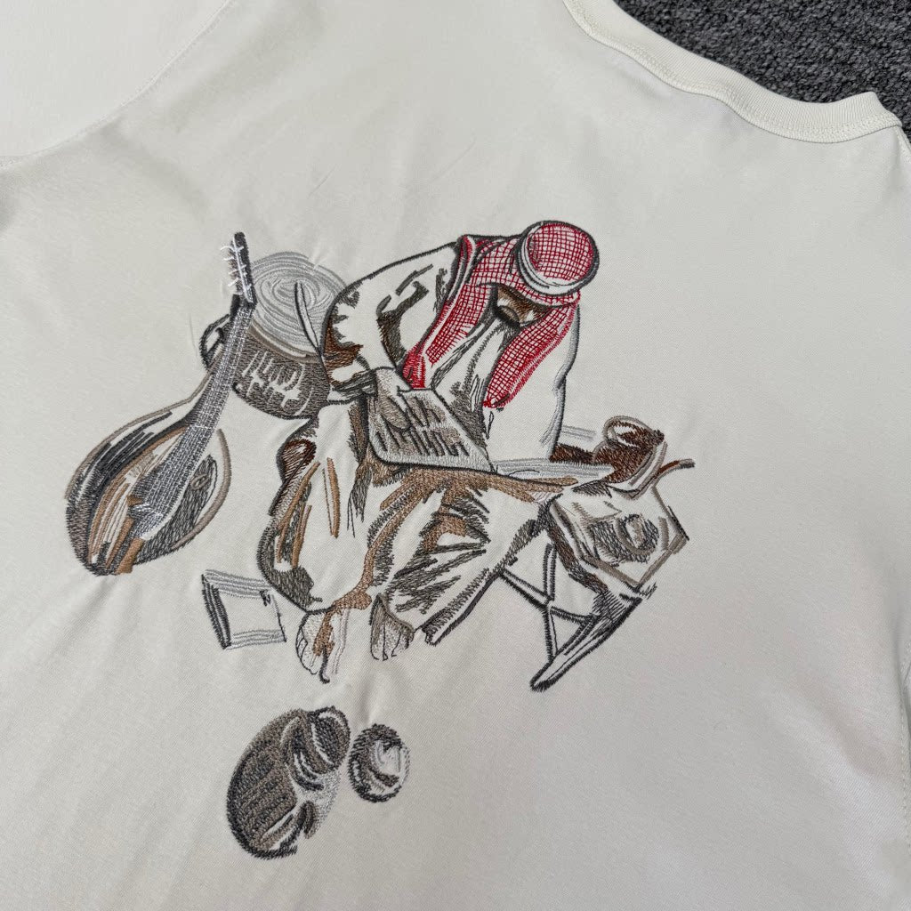 Derschutze Cream Middle Eastern Scholar Musician Back‑Print Graphic Tee